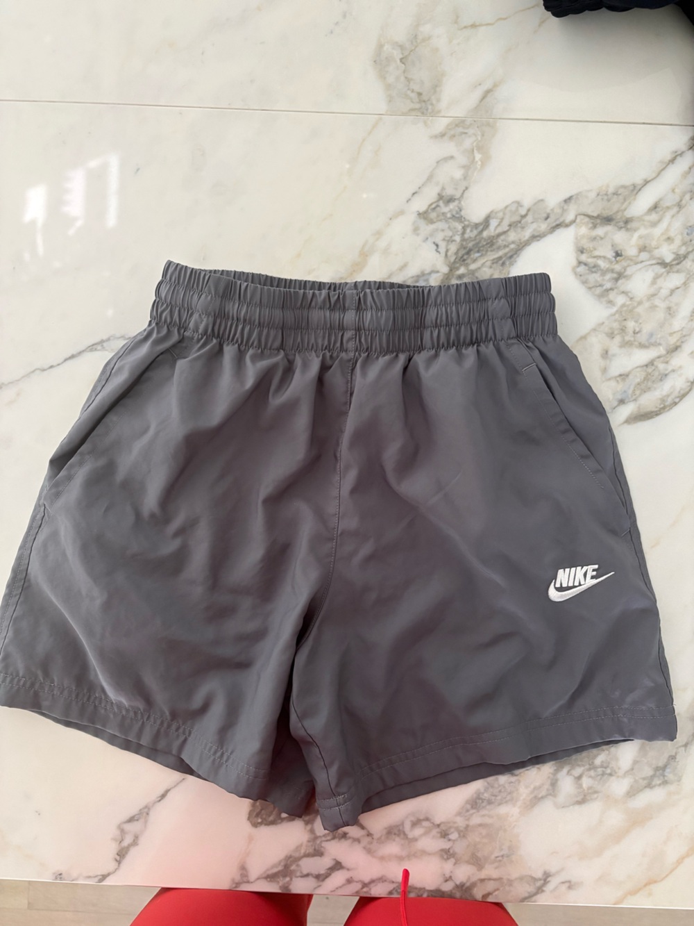 Nike Gray Athletic Shorts with White Swoosh